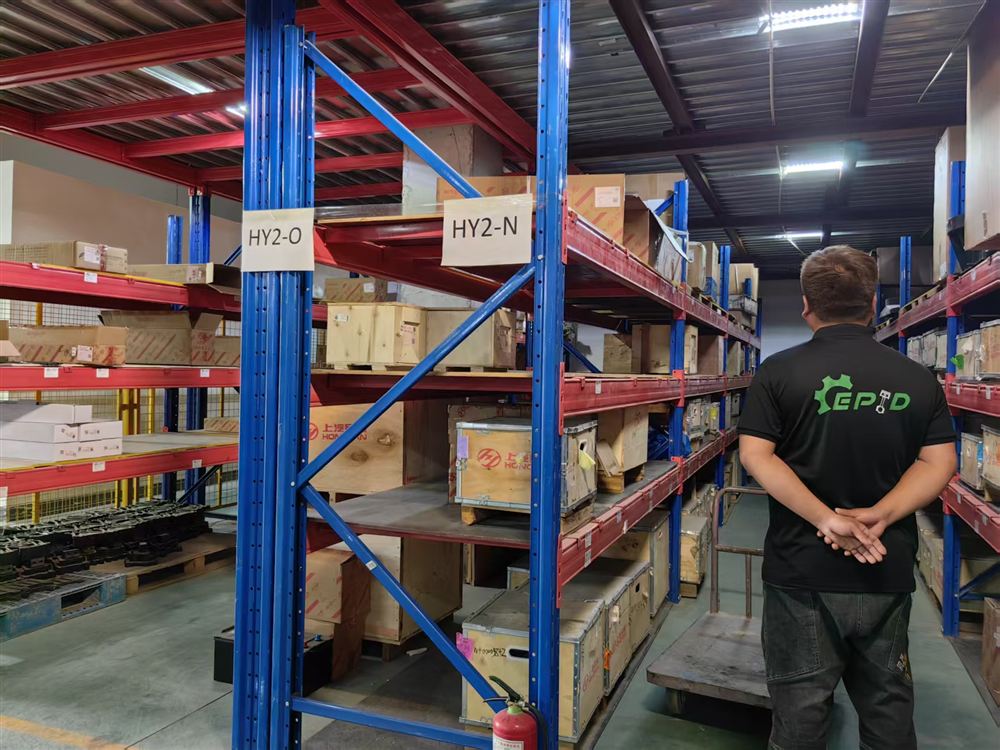 EPID warehouse racking aisle with staff picking parts
