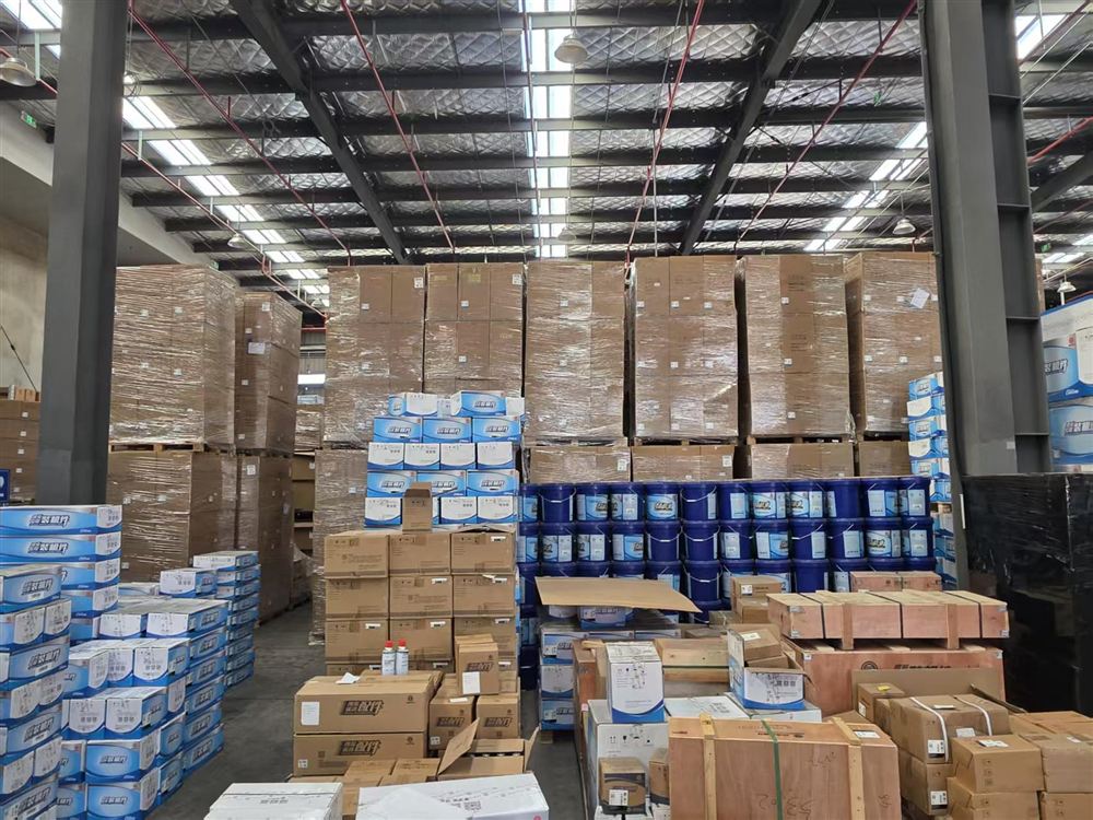 Warehouse racking with blue engine parts cartons